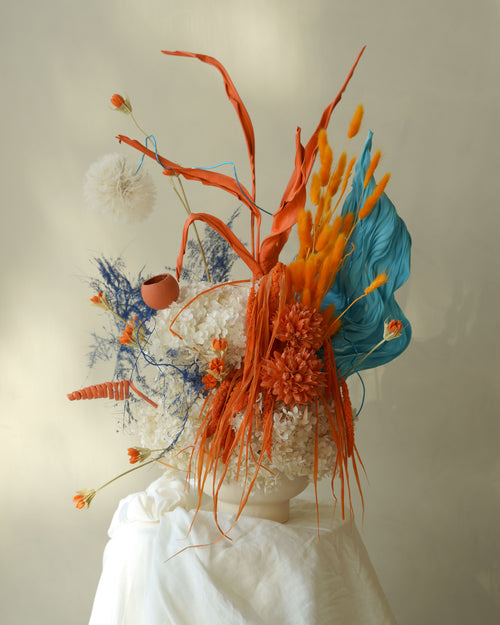Orange-colored dried palm fronds bouquet